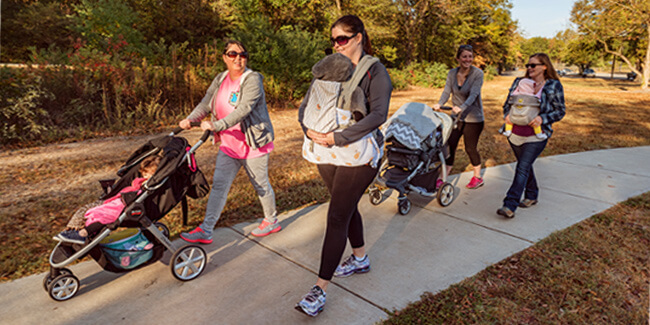 Group of Moms with their children walking outside in Byron Georgia